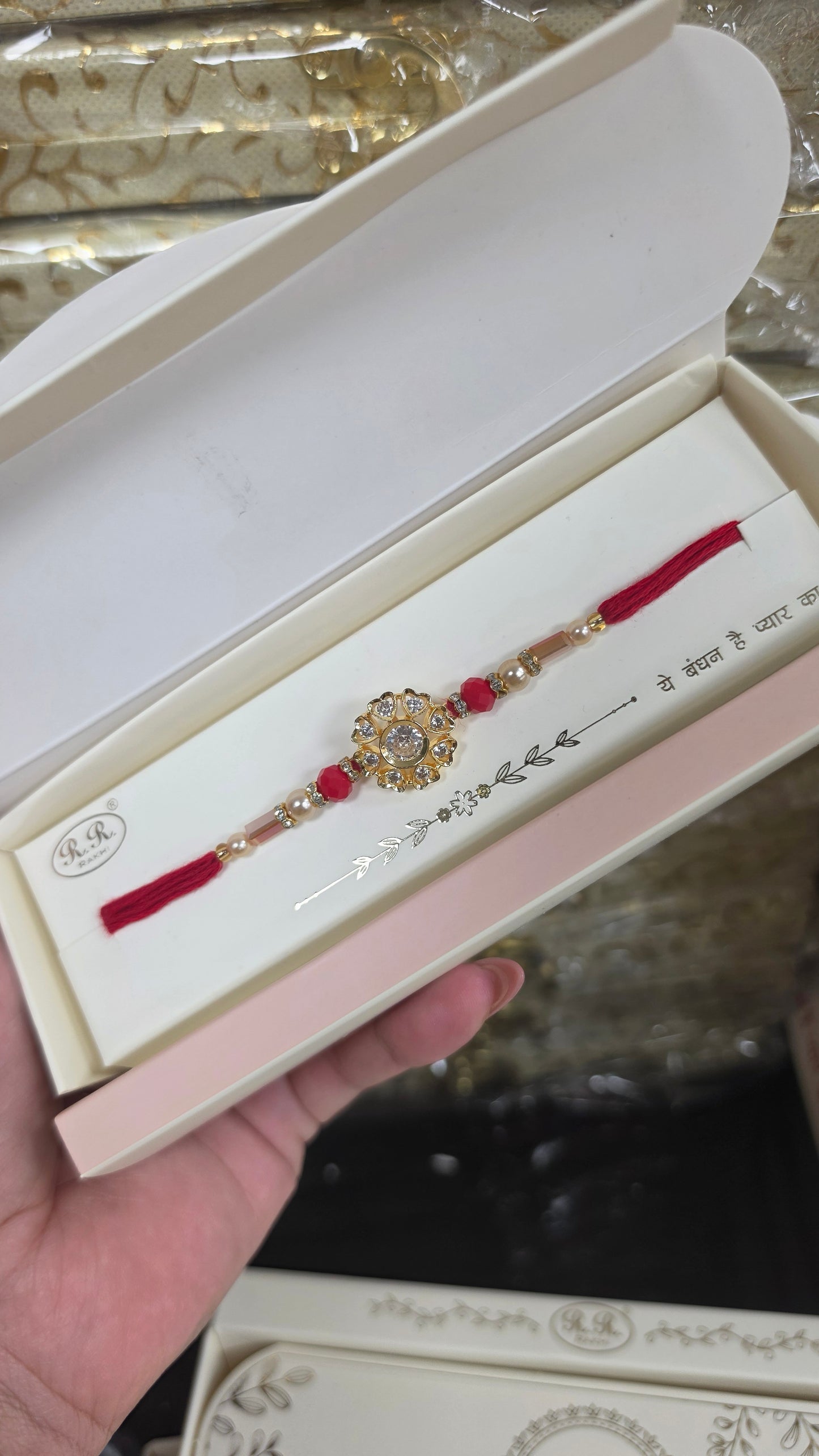 B Mani ad crystal rakhi